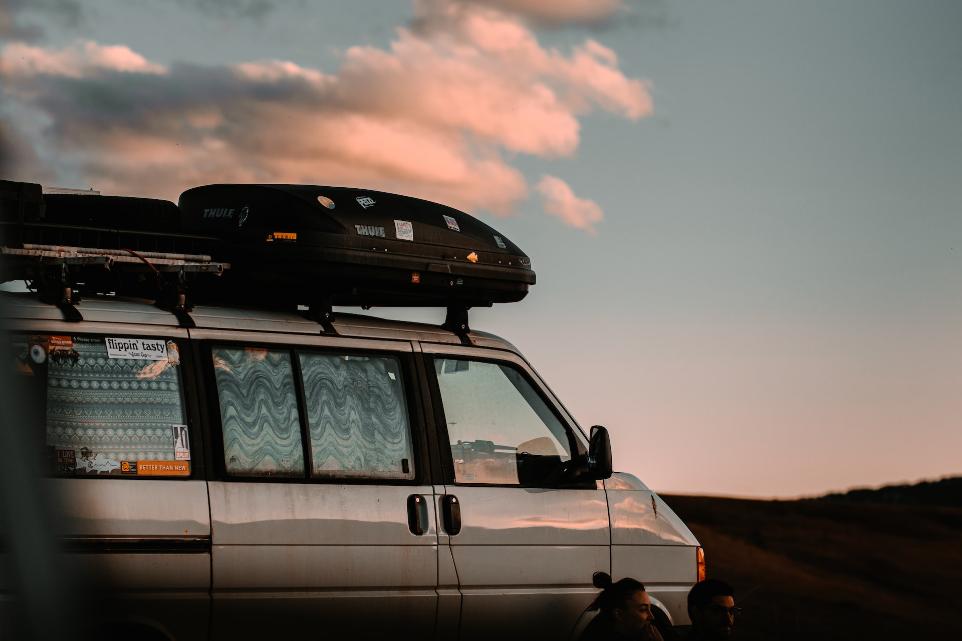 white suv on brown field during sunset